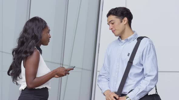 Businessman and businesswoman meeting and shaking hands