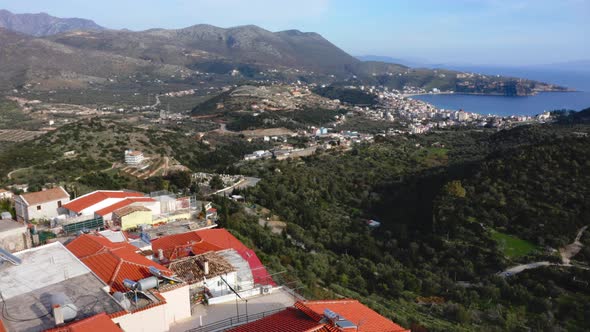 housing rooftops of old town and cityscape on background. Himara town, Vlore, Albanian Riviera. alt