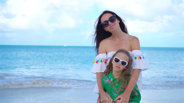 Beautiful Mother and Daughter on Caribbean Beach. Portrait of Family on Summer Vacation alt