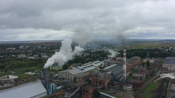 Factory with Thick Smoke From a Chimneys That Litters the Air and Environment alt