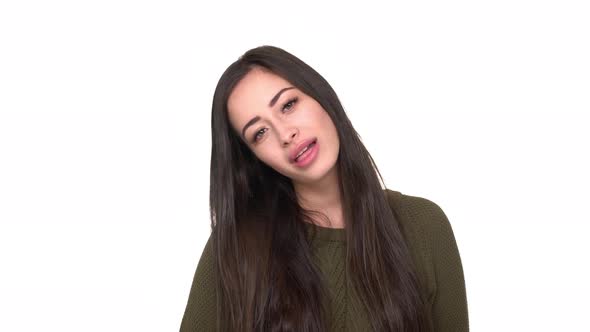 Studio Portrait of Joyous Lady Fooling Around Having Fun with Sticking Her Tongue Out and Protruding alt