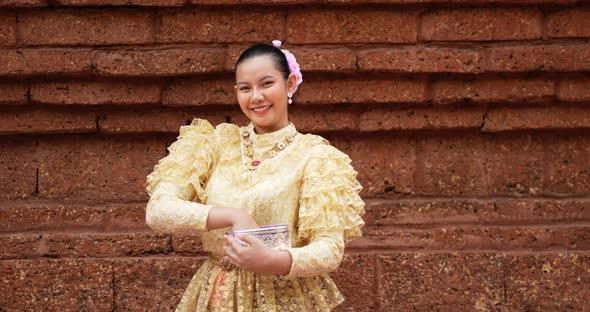 Young beautiful woman enjoy splashing water on Songkran festival alt