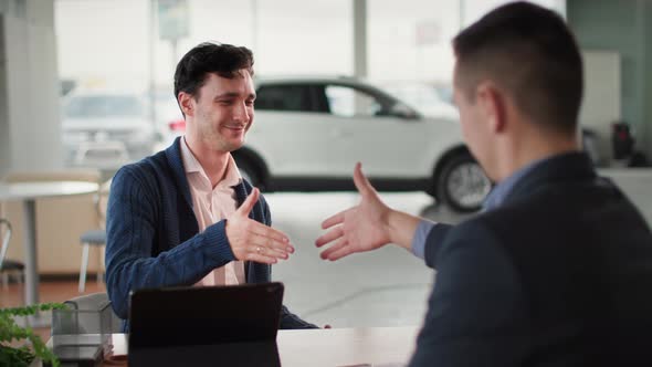 Car Purchase Happy New Vehicle Owner Taking Auto Keys From Sales Manager Sitting at Table in