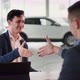 Car Purchase Happy New Vehicle Owner Taking Auto Keys From Sales Manager Sitting at Table in - VideoHive Item for Sale
