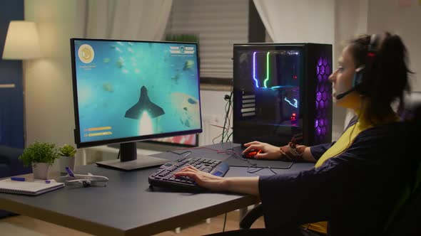 Gamer Playing Online Space Shooter Video Games Using Powerful Computer alt
