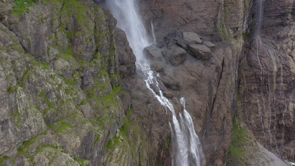 4k drone shot at heart of waterfall in the Cirque de Gavarnie in south of France.  alt