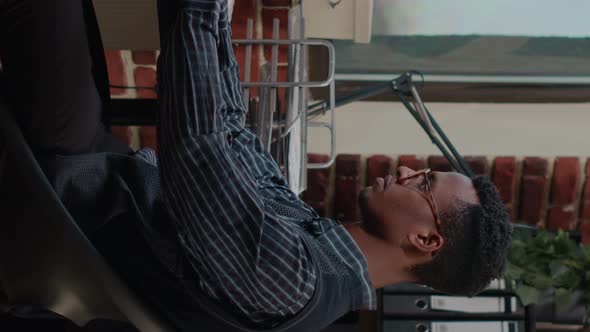 Vertical Video Portrait of Employee Working on Commercial Success at Desk alt