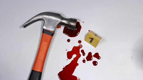 At the Scene of the Crime, the Forensic Expert Takes a Blood Sample for Analysis. alt