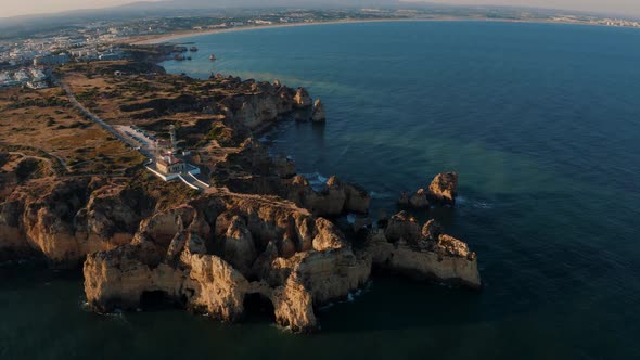 Flying over the sea cliff at Ponta Da Piedade in Algarve, Portugal 4K