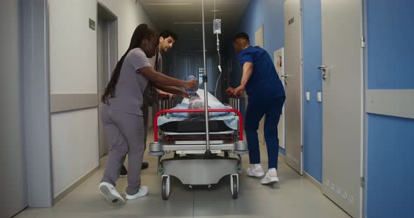 Medical Personnel Transport an Urgent Patient to the Emergency Room alt
