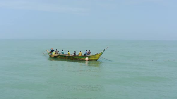 _Aerial shot of a boat or canoe fishing in a sea during the day_25 alt