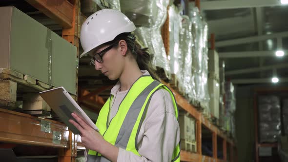 Controller Girl in Safety Helmet and Vest During Factory Inspection alt
