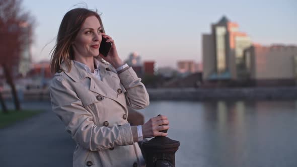 Woman Chatting on the Phone during Walk alt