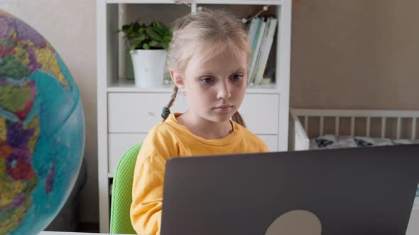 Schoolgirl Girl Uses Laptop