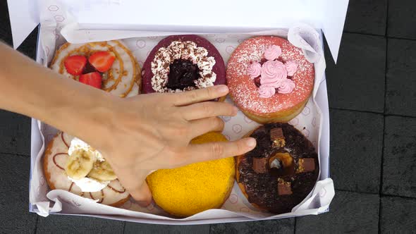 Top View of Vegan Donuts with Different Frostings and Fillings alt