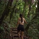 Young Fit Girl Hiking Through Jungle with Stick Slow Motion - VideoHive Item for Sale