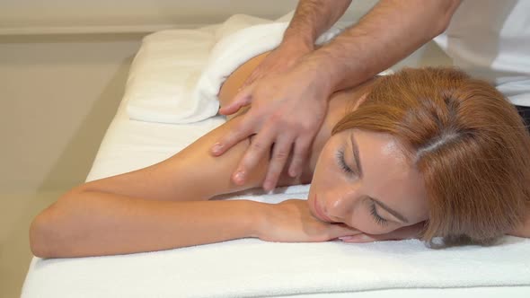 Attractive Woman Getting Professional Massage at Beauty Spa