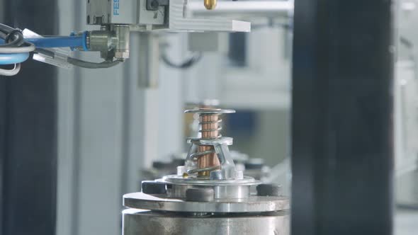 Advanced robotic machine manufacturing parts in an automated assembly line alt