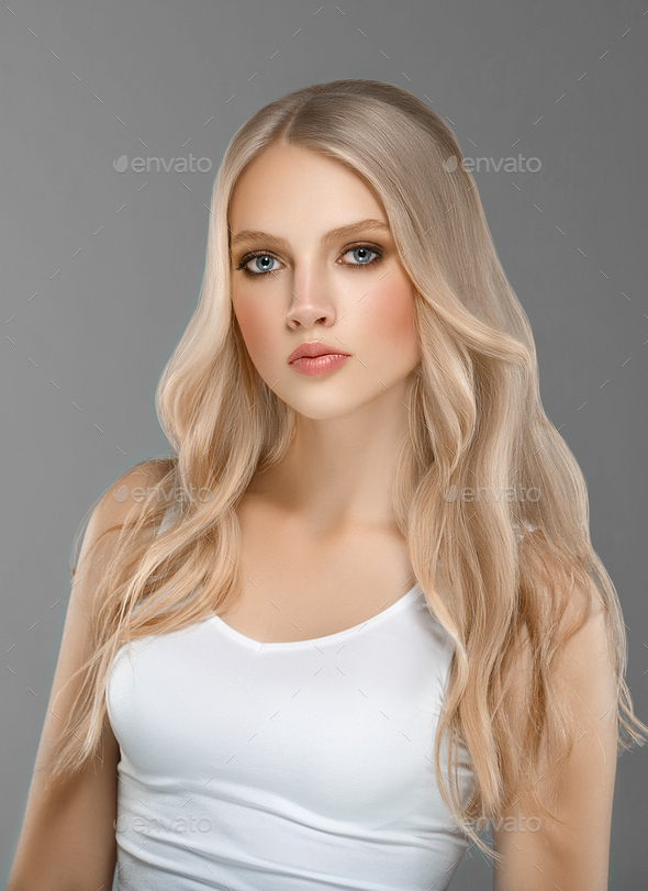 Beautiful Woman Face Portrait Beauty Skin Care Concept with long blonde hair  over gray background Stock Photo by kiraliffe