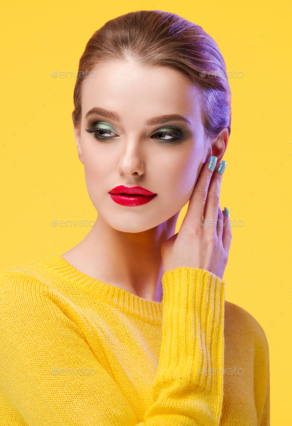 Colorful makeup woman in yellow clothes on color summer background Stock  Photo by kiraliffe