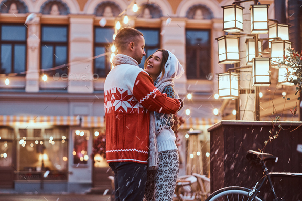 Young romantic couple at Christmas time, enjoying spending time together