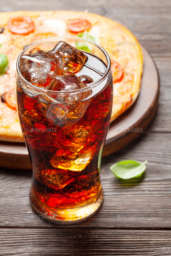 Tasty homemade pizza with cola drink