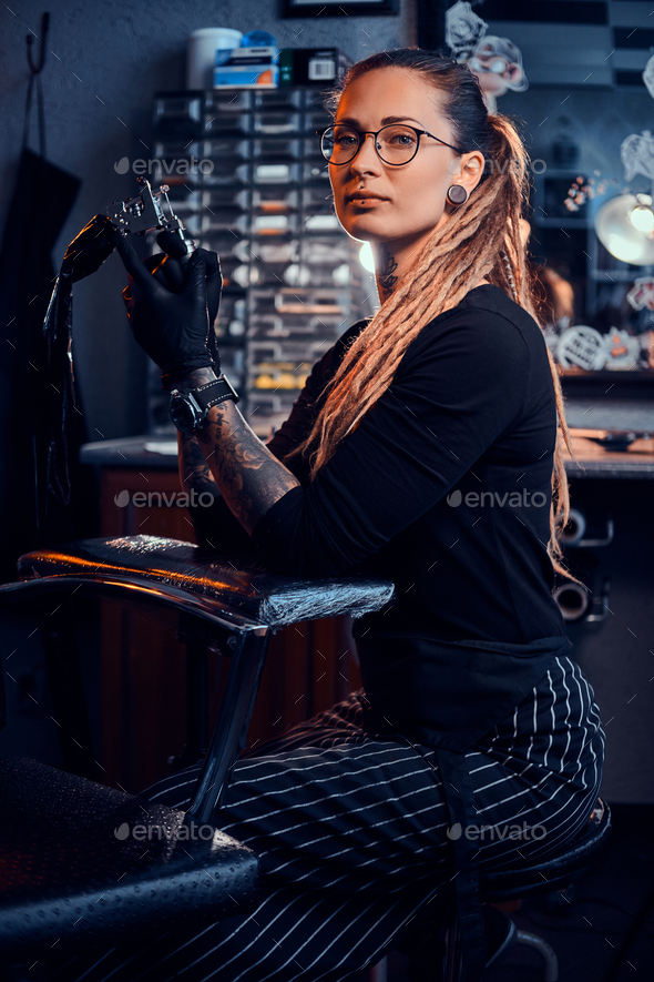 Portrait of Attractive Young Woman with Tattoo Machine in Hands Stock Photo  - Image of season, glasses: 156043356
