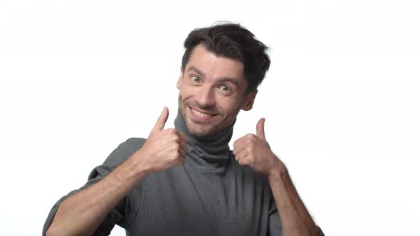 Slowmotion Handsome Cheerful Father Young Dad with Bristle in Turtleneck Sweater Saying Congrats alt