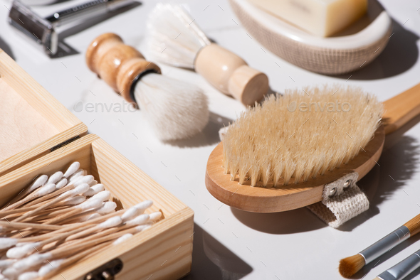 Selective focus of shaving brushes, box of ear sticks
