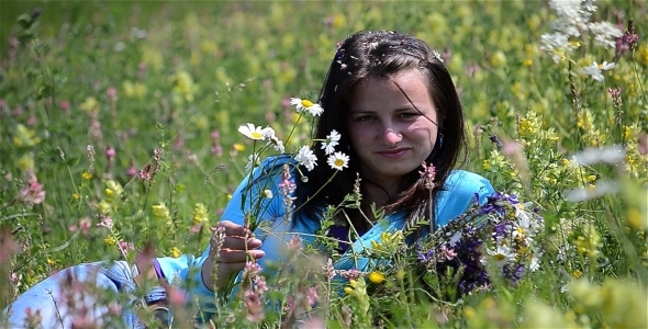 Girl Relaxing In A Flower Field 3