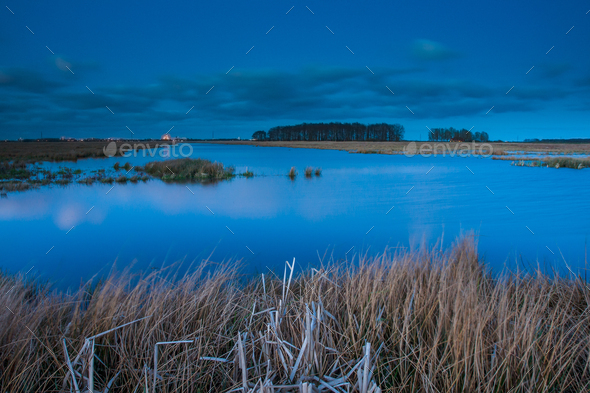 View of lake at blue hour - Stock Photo - Images