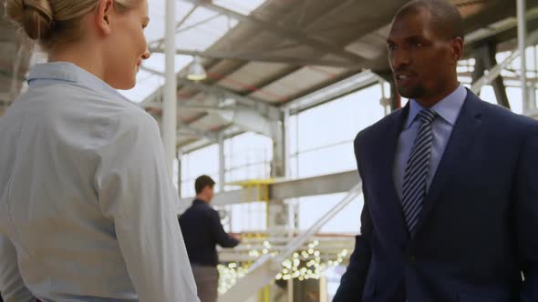 Colleagues meeting in the foyer at a business convention alt