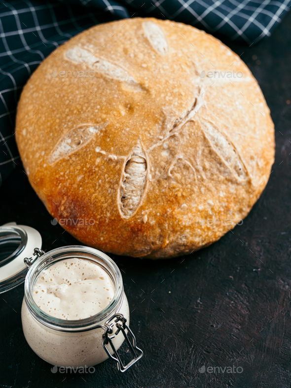 Wheat round sourdough bread, copy space, vertical
