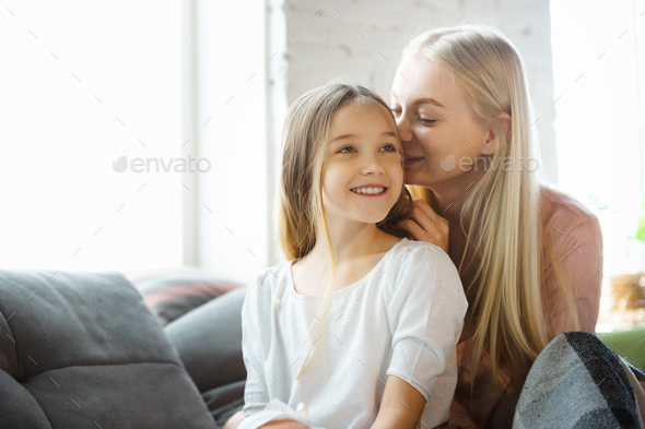 Mother and daughter, sisters have quite, beauty and fun day together at home. Comfort and