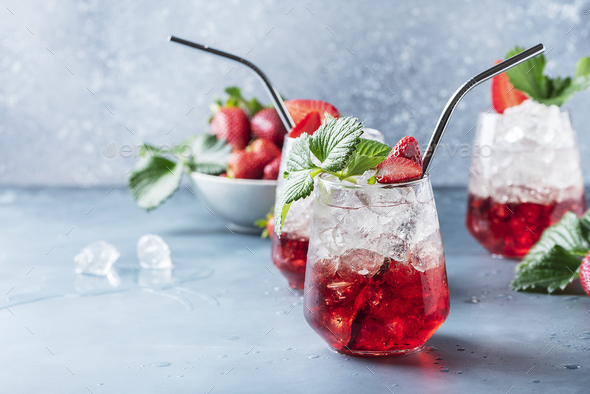 Red cocktail with ice and fresh strawberry - Stock Photo - Images