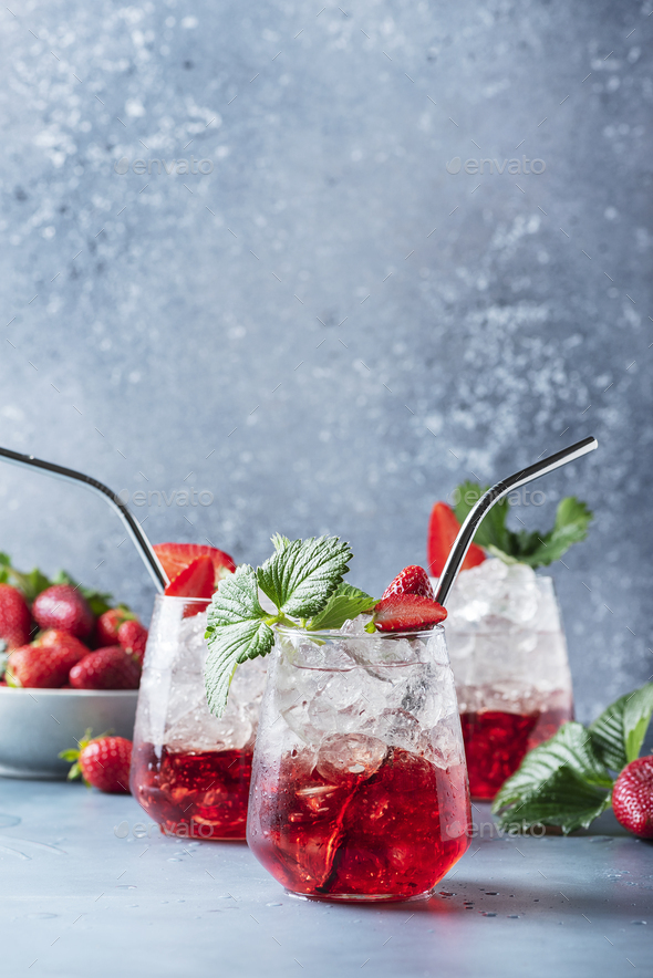 Red cocktail with ice and fresh strawberry - Stock Photo - Images