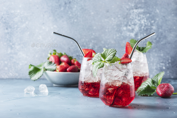 Red cocktail with ice and fresh strawberry - Stock Photo - Images