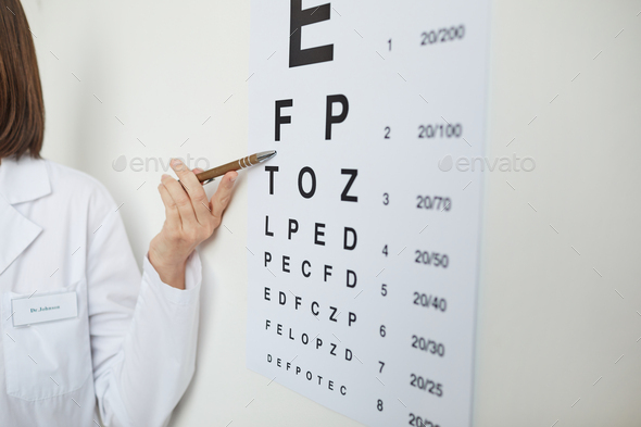 Opthalmologist Pointing at Eye Chart Close Up