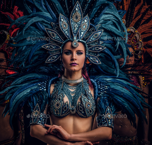 Woman in brazilian samba carnival costume with colorful feathers