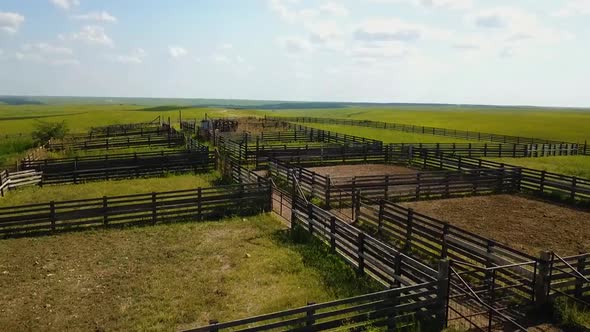 Aerial drone shot of the Bazaar Cattle Pens in the Flint Hills, Kansas. Rising shot. alt