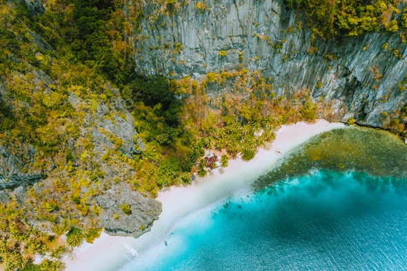 Aerial drone view of abandoned house hut on Pinagbuyutan Island in El Nido. Amazing white sand beach - Stock Photo - Images