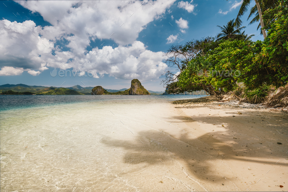 Vacation holiday season on Palawan island. Remote beach on island hopping tour. Ipil beach of