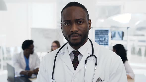 Confident African Male Doctor with Team of Cowoker alt