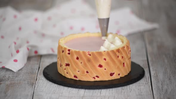 Chef Decorating Raspberry Mousse Cake alt