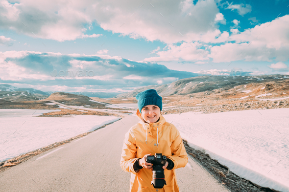 Aurlandsfjellet, Norway. Young Happy Woman Tourist Traveler Photographer Taking Pictures Photos Of - Stock Photo - Images