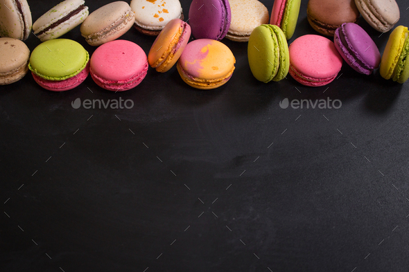 Assorted colorful macaroons on a dark background - Stock Photo - Images