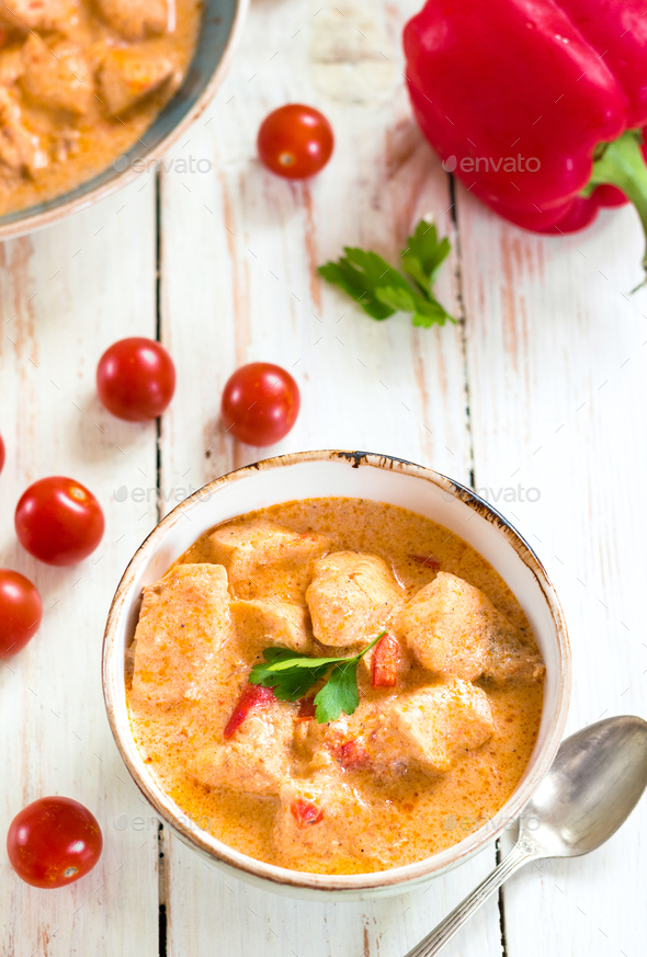 Delicious chicken stew with paprika in a bowl - Stock Photo - Images