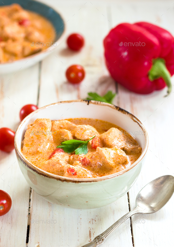 Delicious chicken stew with paprika in a bowl - Stock Photo - Images