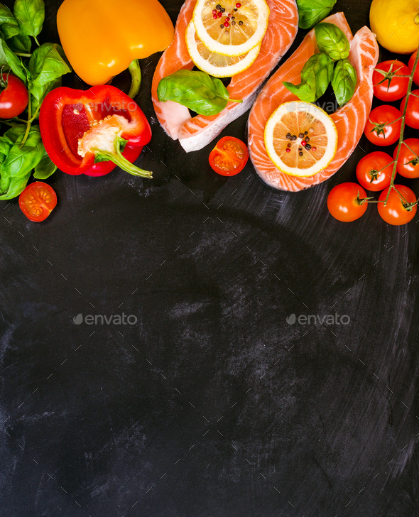 Raw salmon steaks and fresh ingredients for cooking - Stock Photo - Images