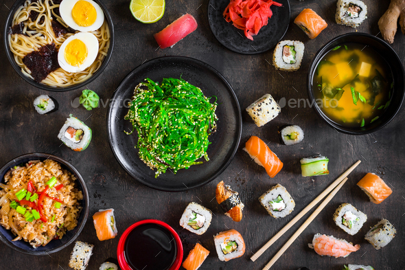 Table served with sushi and traditional japanese food - Stock Photo - Images